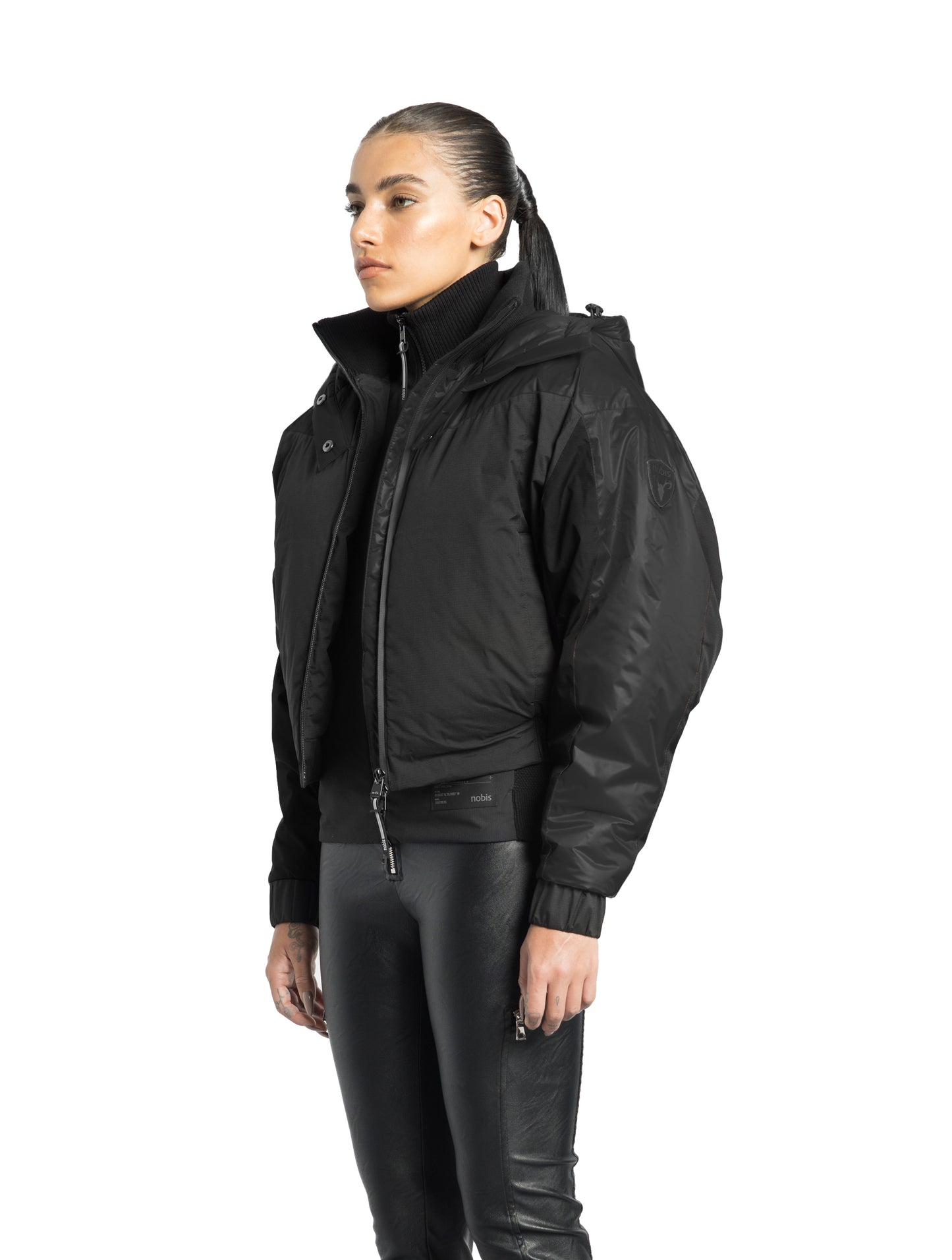 Aspen Women's Batwing Jacket in hip length, premium stretch ripstop and cire technical nylon taffeta fabrication, Premium Canadian White Duck Down insulation, non-removable down-filled hood, centre front two-way zipper, winged arm detailing, in Black