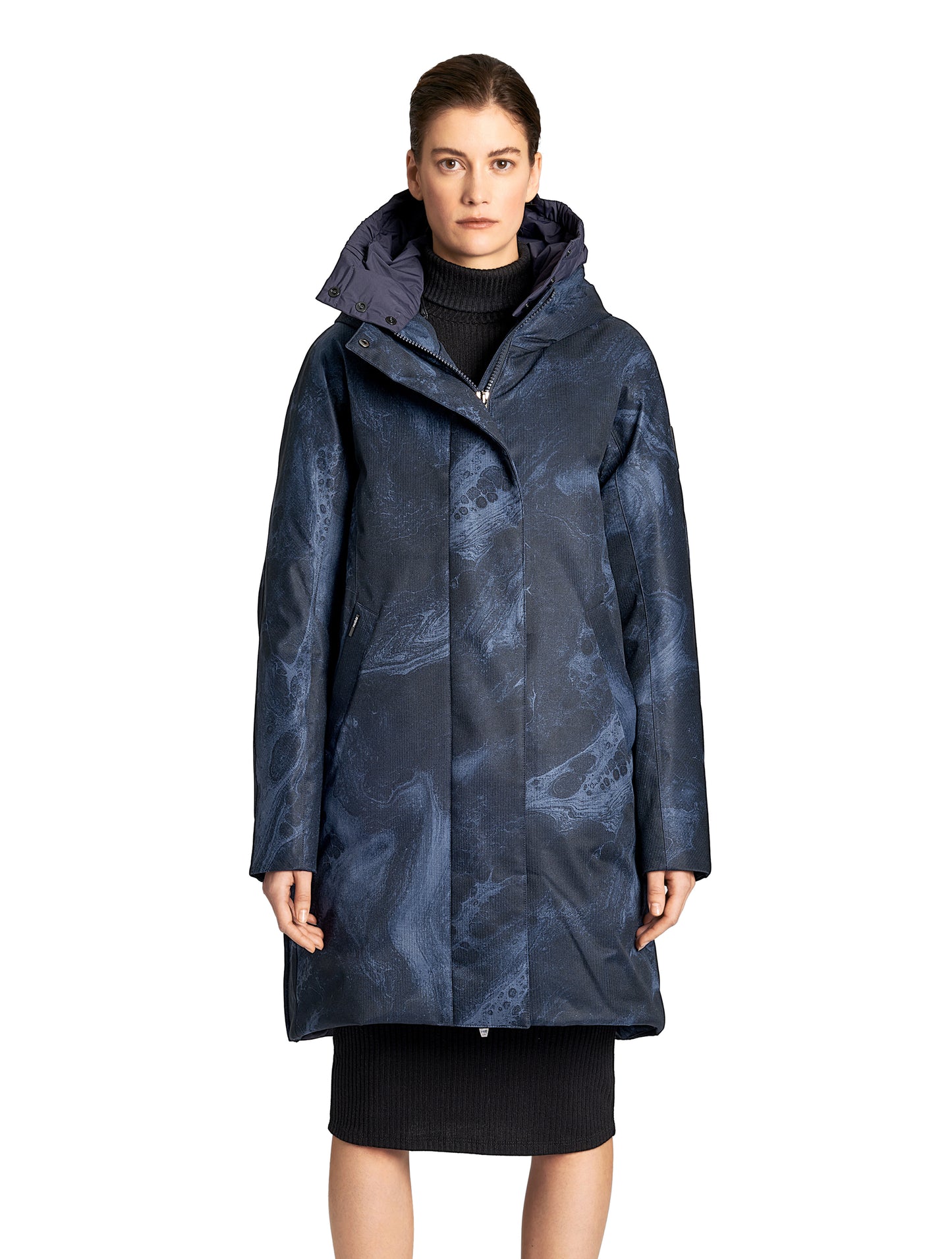 Dory Women's Tailored Back Zip Parka in knee length, premium Crosshatch fabrication, Premium Canadian White Duck Down insulation, non-removable down-filled hood, removable interior hood, centre front two-way zipper with wind flap, vertical zipper detailing along back, in Navy