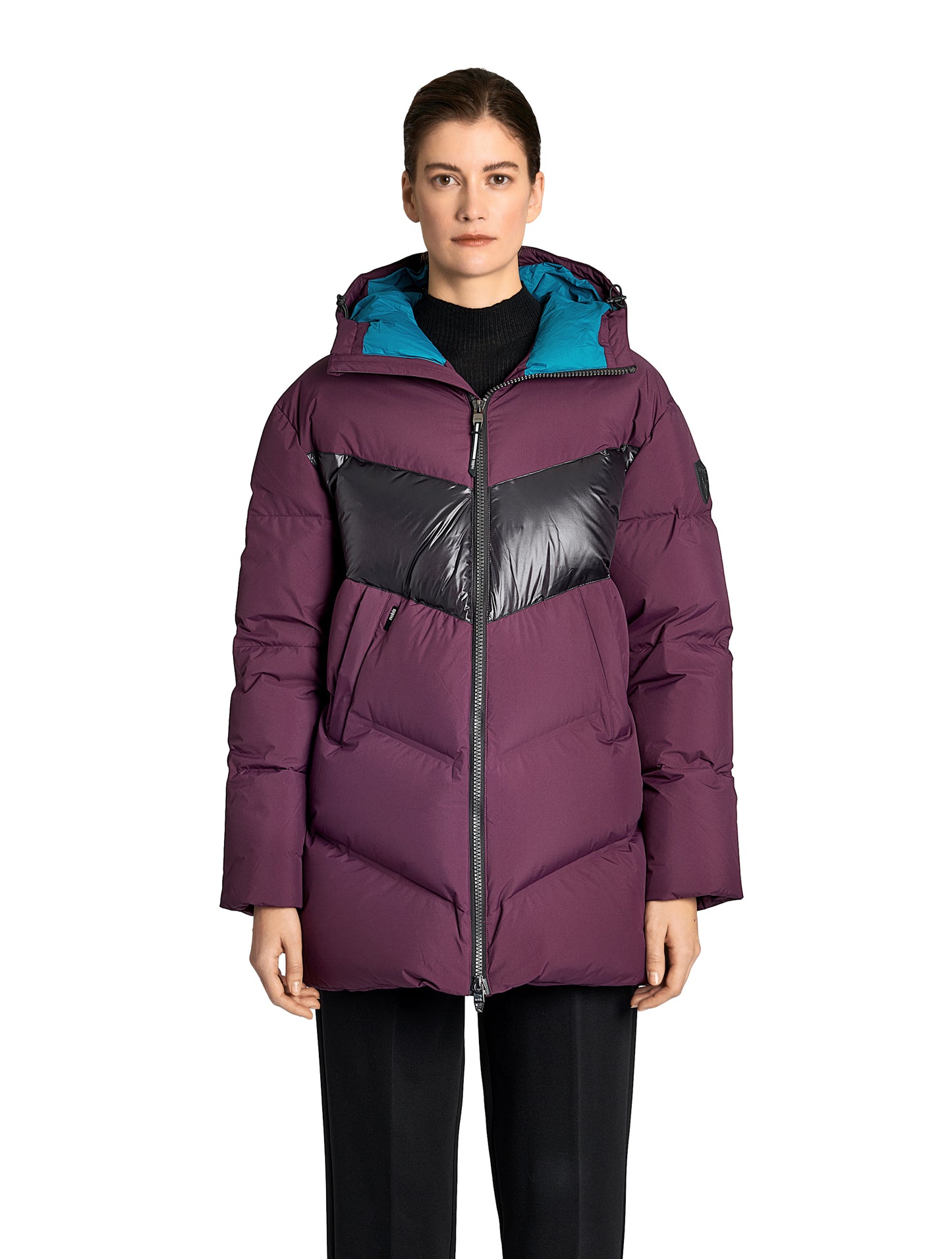 Isla Women's Chevron Quilted Puffer Jacket in thigh length, premium technical nylon taffeta fabrication, Premium Canadian origin White Duck Down insulation, non-removable down-filled hood, two-way centre-front zipper, zipper pockets at waist, contrast cire technical nylon taffeta detailing on chest and back, in Potent Purple