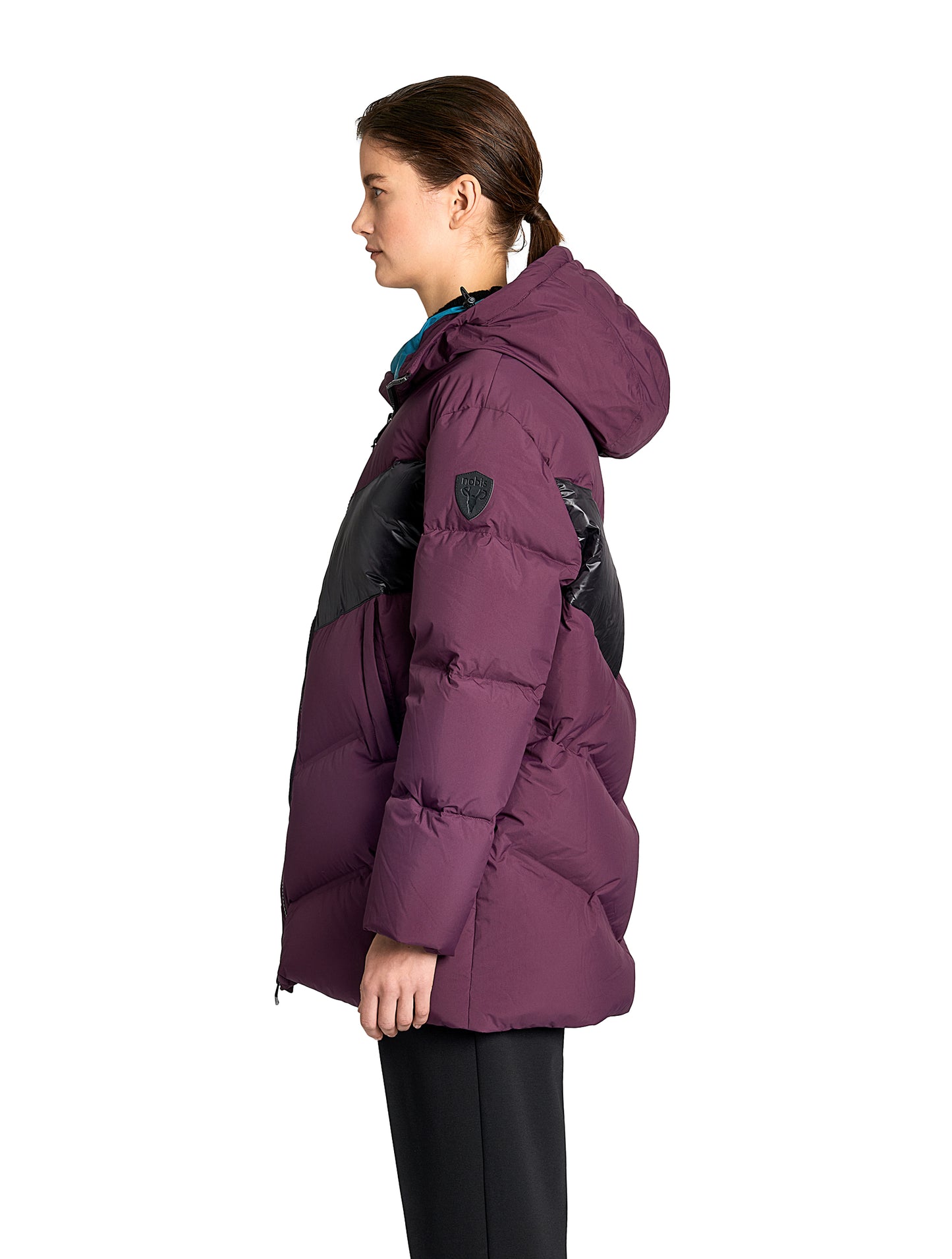 Isla Women's Chevron Quilted Puffer Jacket in thigh length, premium technical nylon taffeta fabrication, Premium Canadian origin White Duck Down insulation, non-removable down-filled hood, two-way centre-front zipper, zipper pockets at waist, contrast cire technical nylon taffeta detailing on chest and back, in Potent Purple