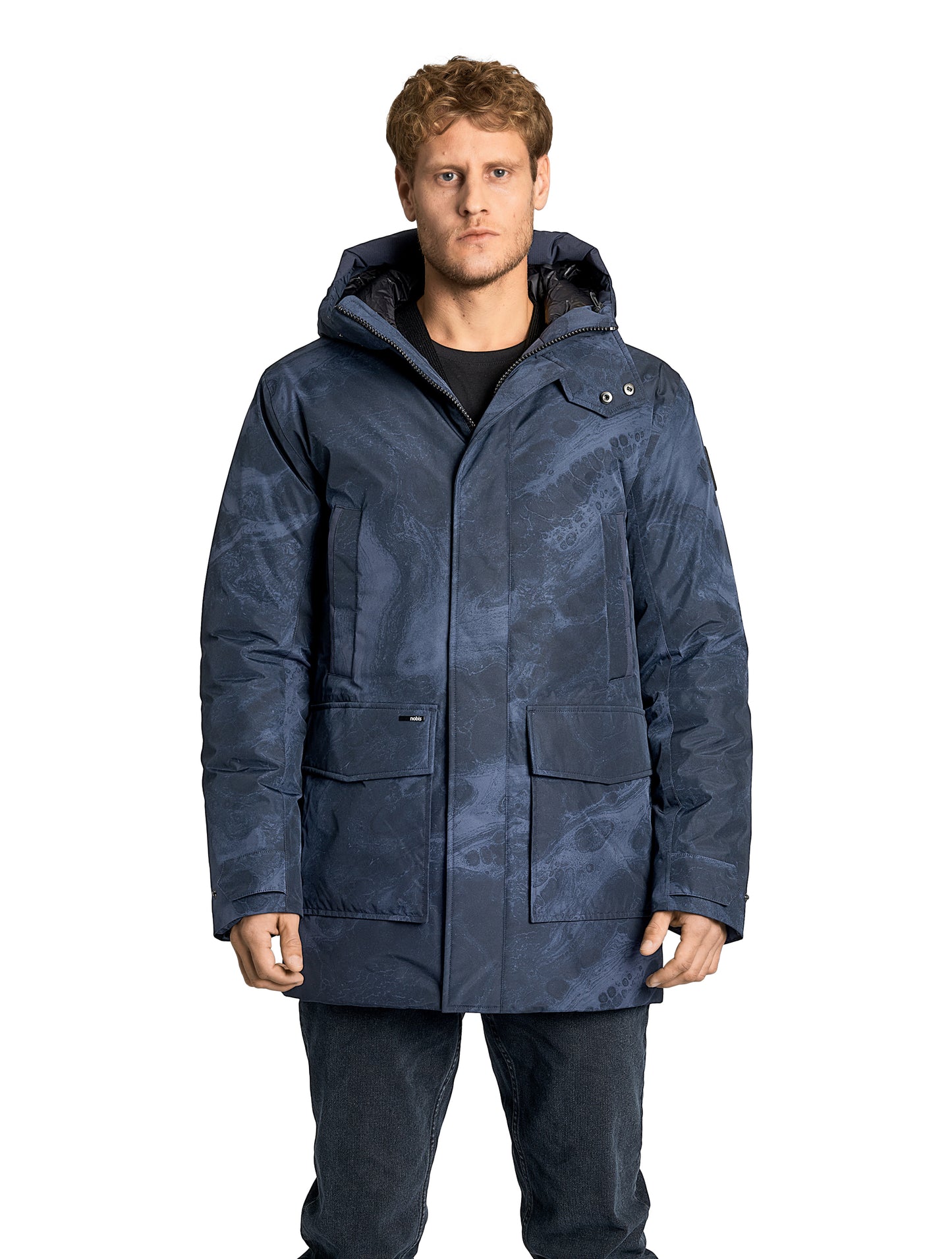 Kason Men's Light Down Parka in thigh length, premium 3-ply micro denier and stretch ripstop fabrication, Premium Canadian origin White Duck Down insulation, non-removable down-filled hood, two-way centre-front zipper, magnetic closure wind flap, fleece-lined pockets at chest and waist, flap pockets at waist, pit zipper vents, in Navy