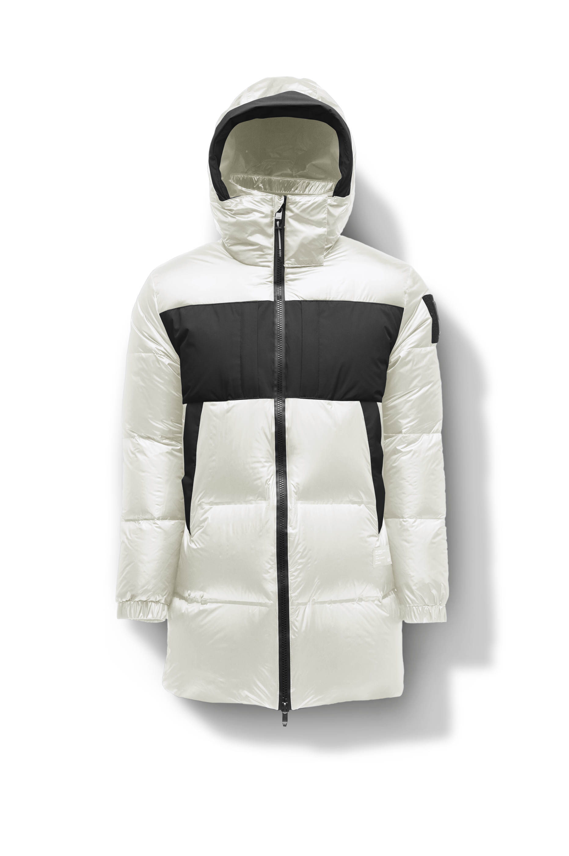 Neelix Men's Long Puffer Jacket in thigh length, premium cire technical nylon taffeta and stretch ripstop fabrication, Premium Canadian origin White Duck Down insulation, non-removable down-filled hood, two-way centre-front zipper, pit zipper vents, hidden chest zipper pockets, fleece-lined magnetic closure waist pockets, in Chalk