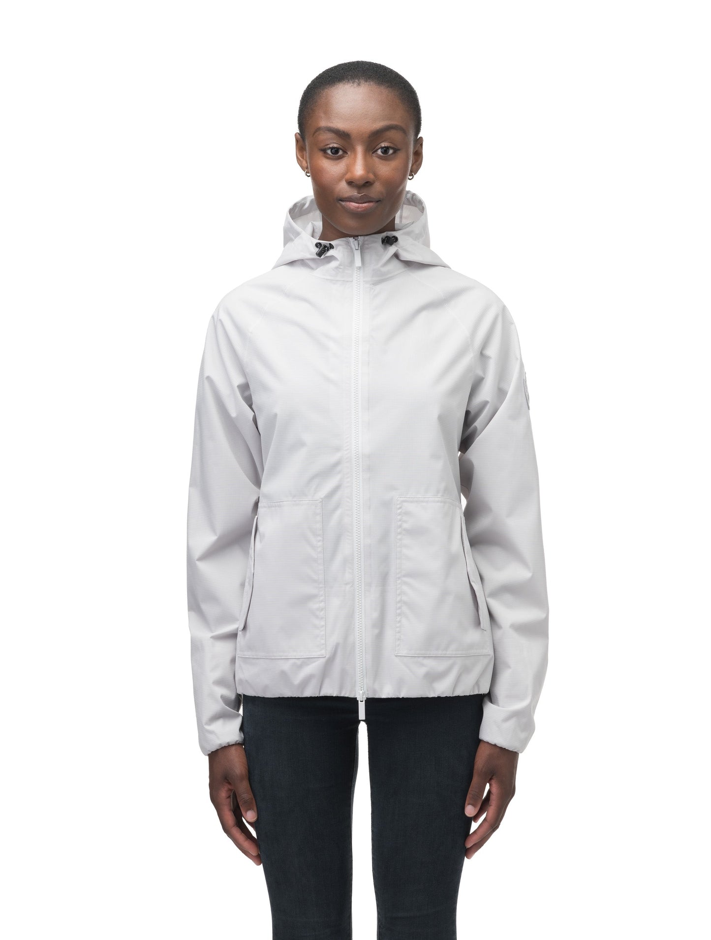 Women's hip length waterproof jacket with non-removable hood and two-way zipper in Light Grey