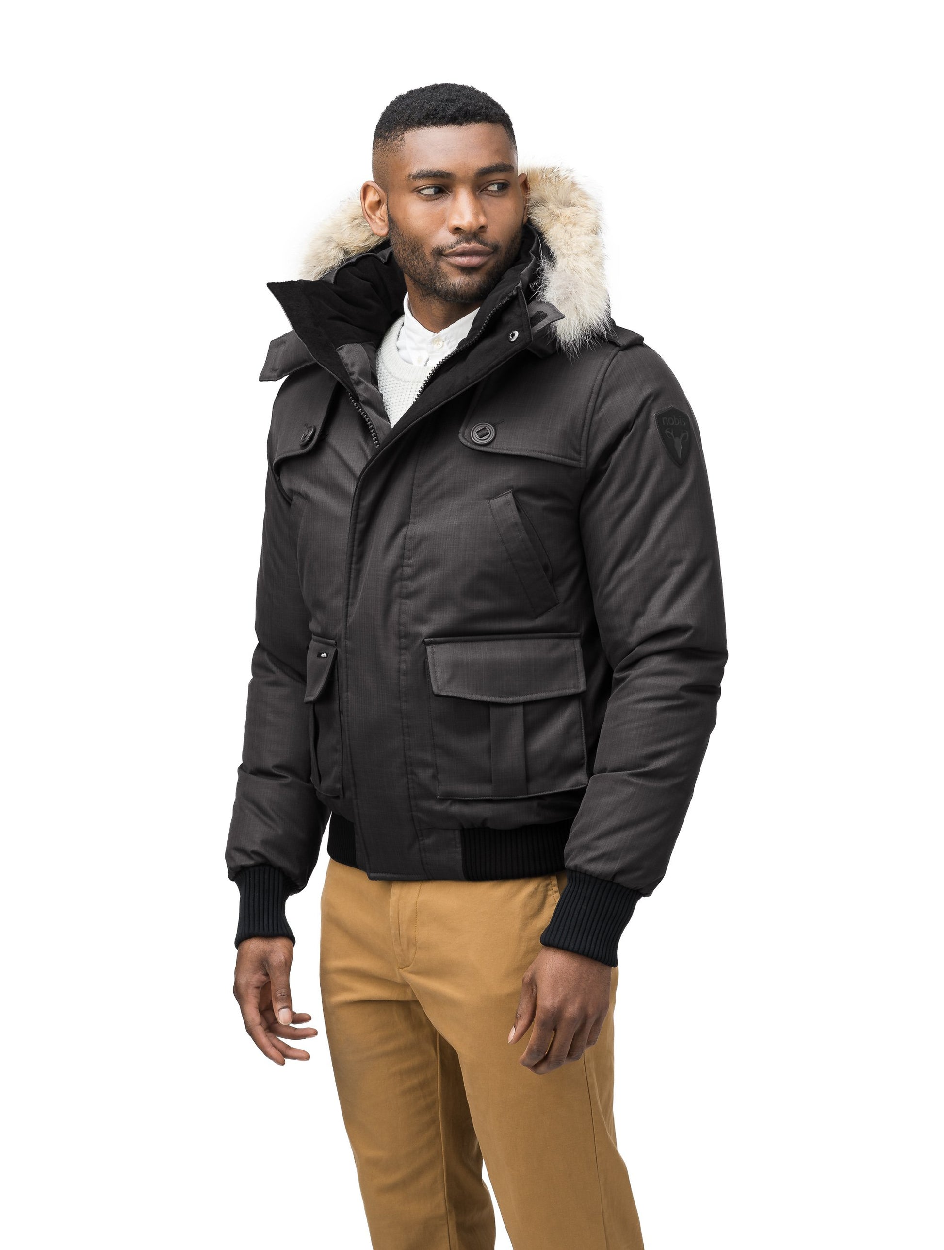 Men's down filled bomber that sits just above the hips with a completely removable hood that's windproof, waterproof, and breathable in Black