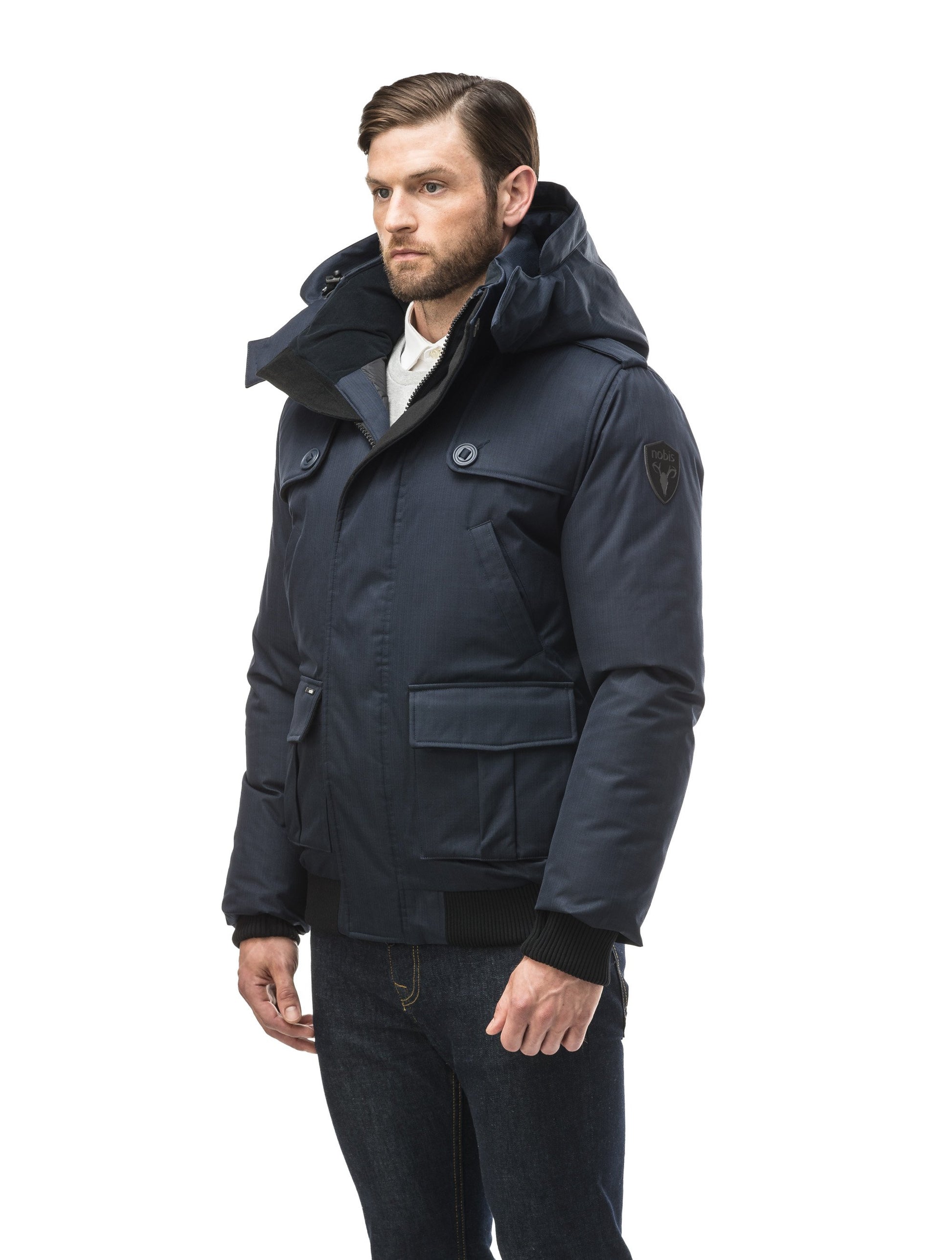 Men's down filled bomber that sits just above the hips with a completely removable hood that's windproof, waterproof, and breathable in CH Light Grey