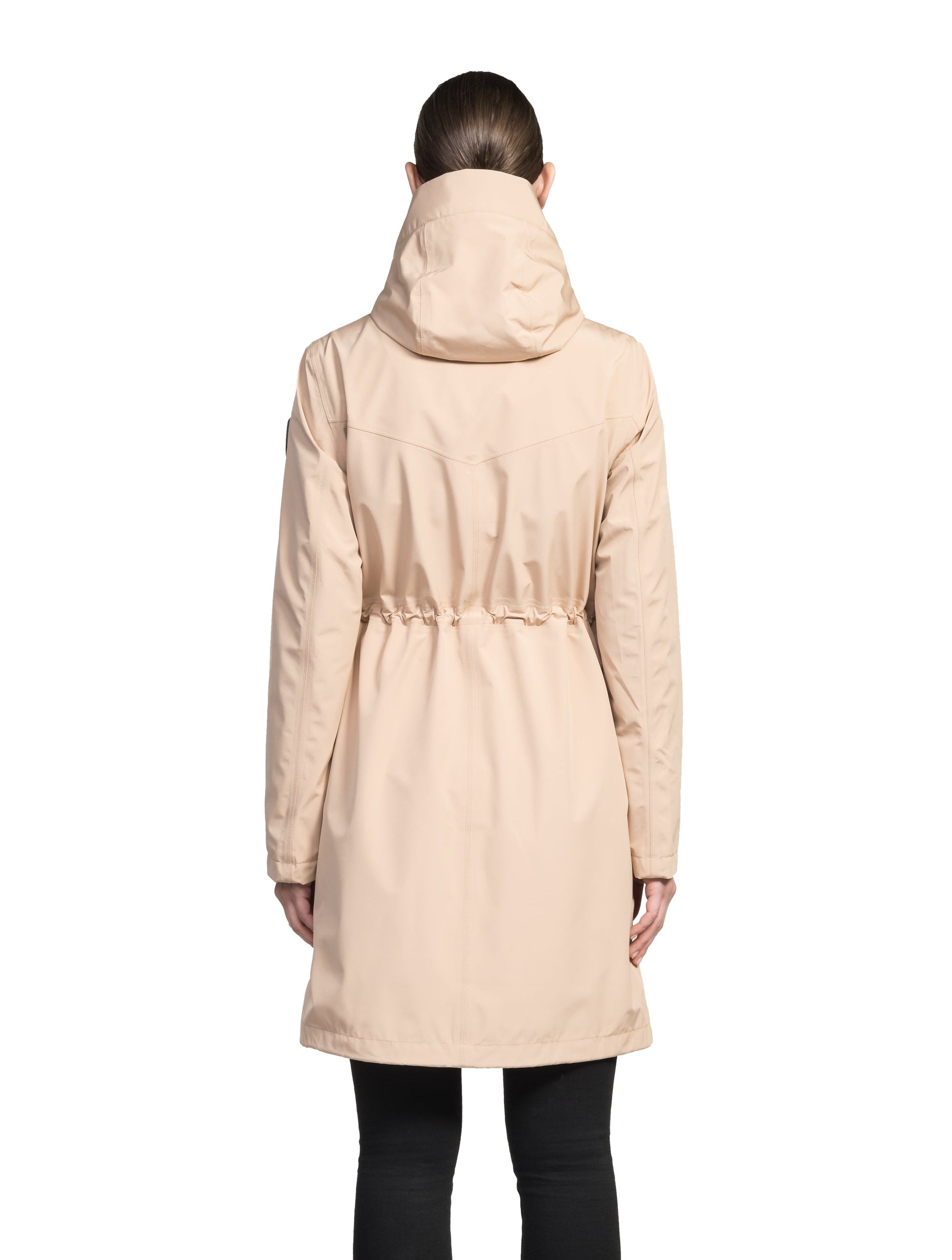 Women's knee length anorak with four front pockets and adjustable cord waist in Fawn