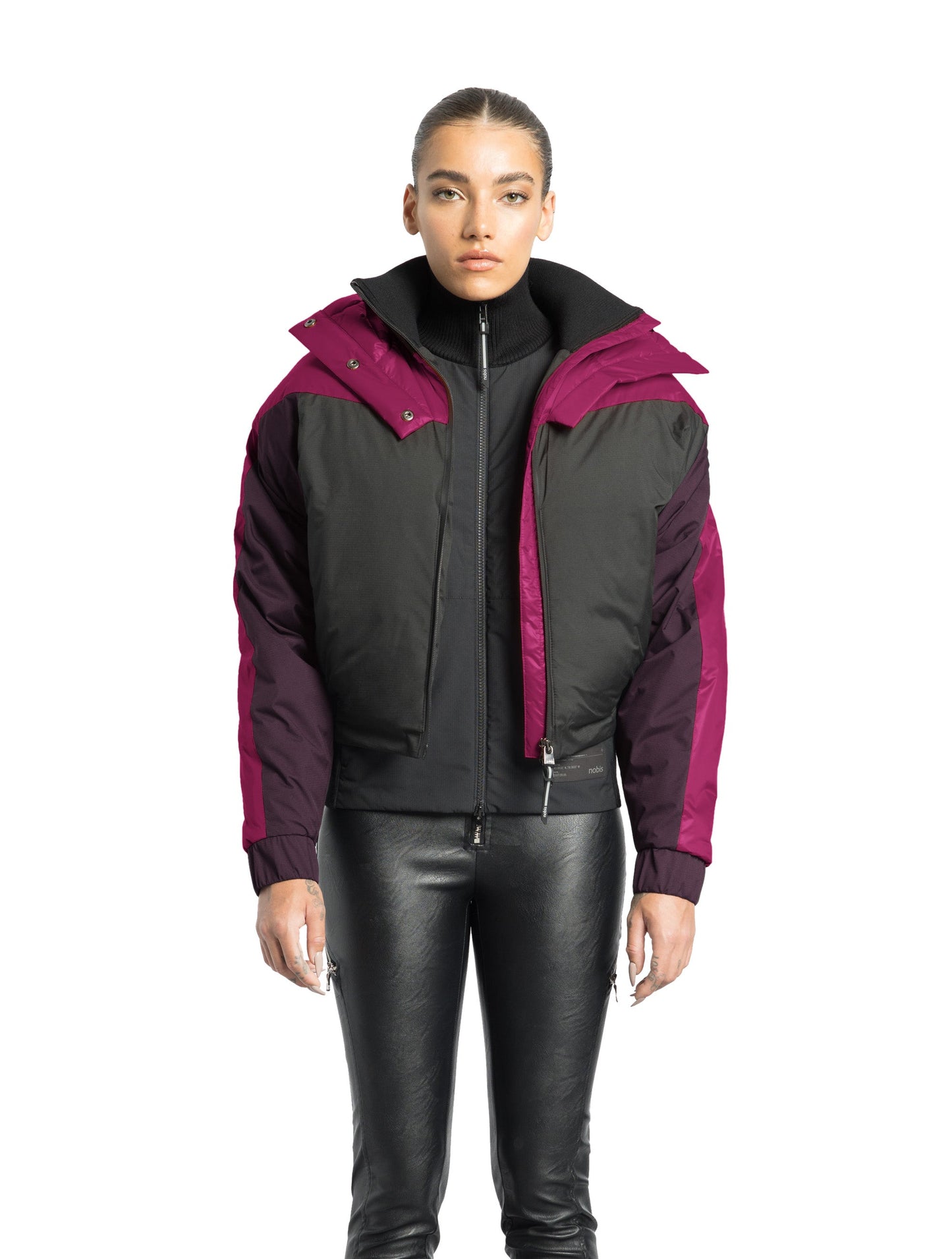 Aspen Women's Batwing Jacket in hip length, premium stretch ripstop and cire technical nylon taffeta fabrication, Premium Canadian White Duck Down insulation, non-removable down-filled hood, centre front two-way zipper, winged arm detailing, in Festival Fushia/Potent Purple