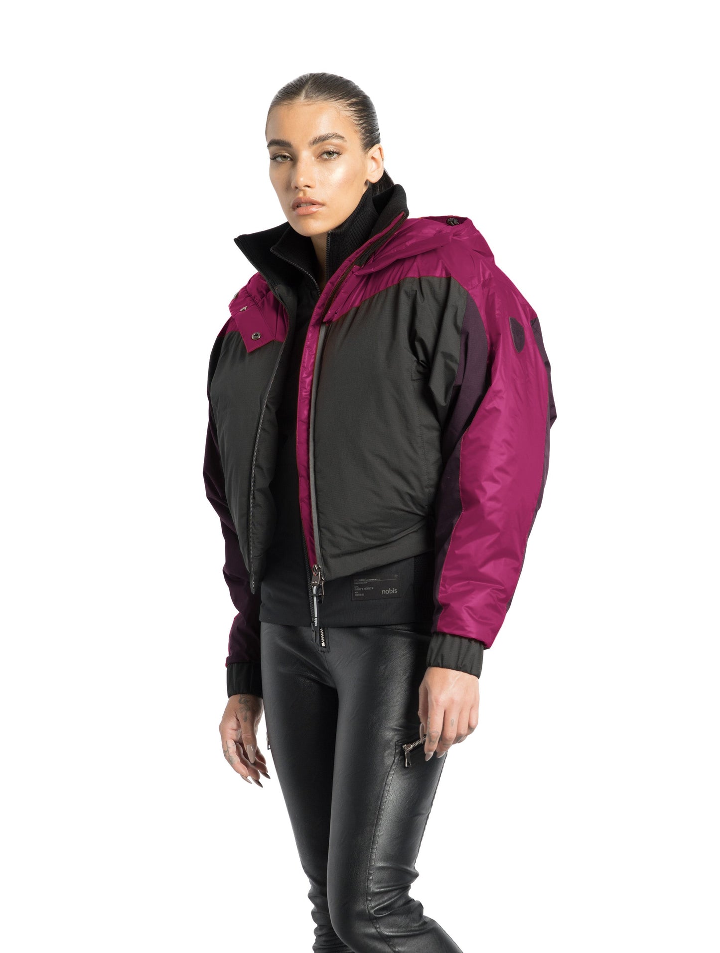 Aspen Women's Batwing Jacket in hip length, premium stretch ripstop and cire technical nylon taffeta fabrication, Premium Canadian White Duck Down insulation, non-removable down-filled hood, centre front two-way zipper, winged arm detailing, in Festival Fushia/Potent Purple