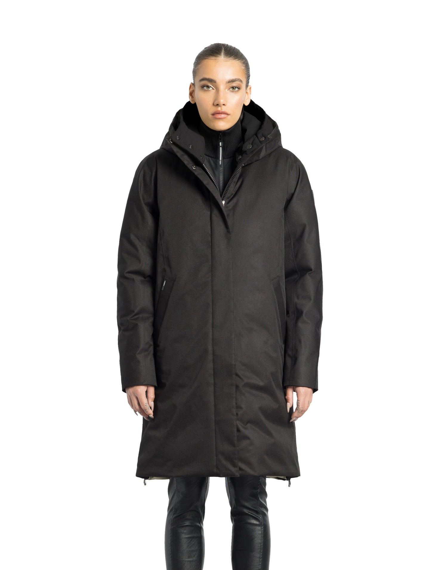 Dory Women's Tailored Back Zip Parka in knee length, premium Crosshatch fabrication, Premium Canadian White Duck Down insulation, non-removable down-filled hood, removable interior hood, centre front two-way zipper with wind flap, vertical zipper detailing along back, in Black