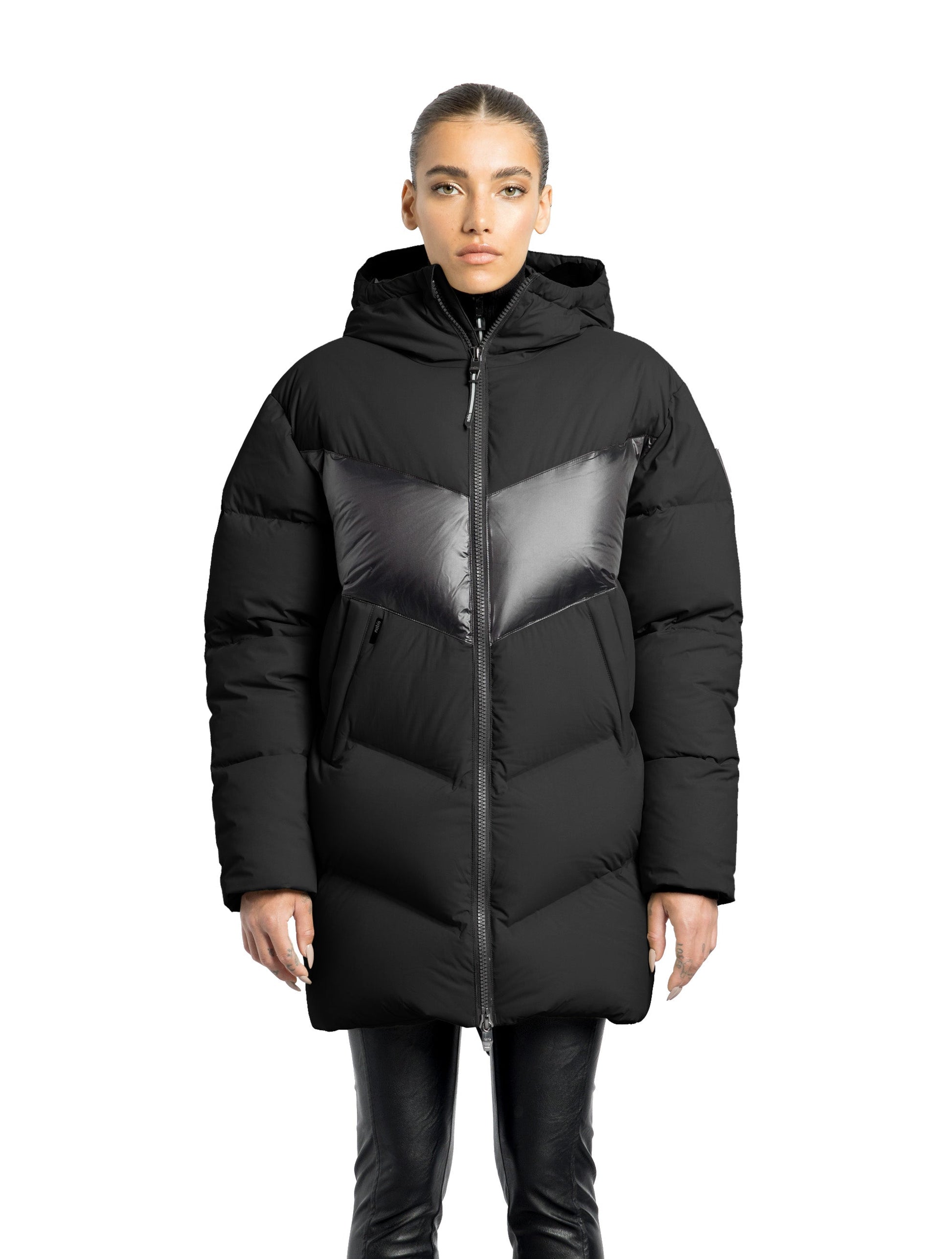 Isla Women's Chevron Quilted Puffer Jacket in thigh length, premium technical nylon taffeta fabrication, Premium Canadian origin White Duck Down insulation, non-removable down-filled hood, two-way centre-front zipper, zipper pockets at waist, contrast cire technical nylon taffeta detailing on chest and back, in Black