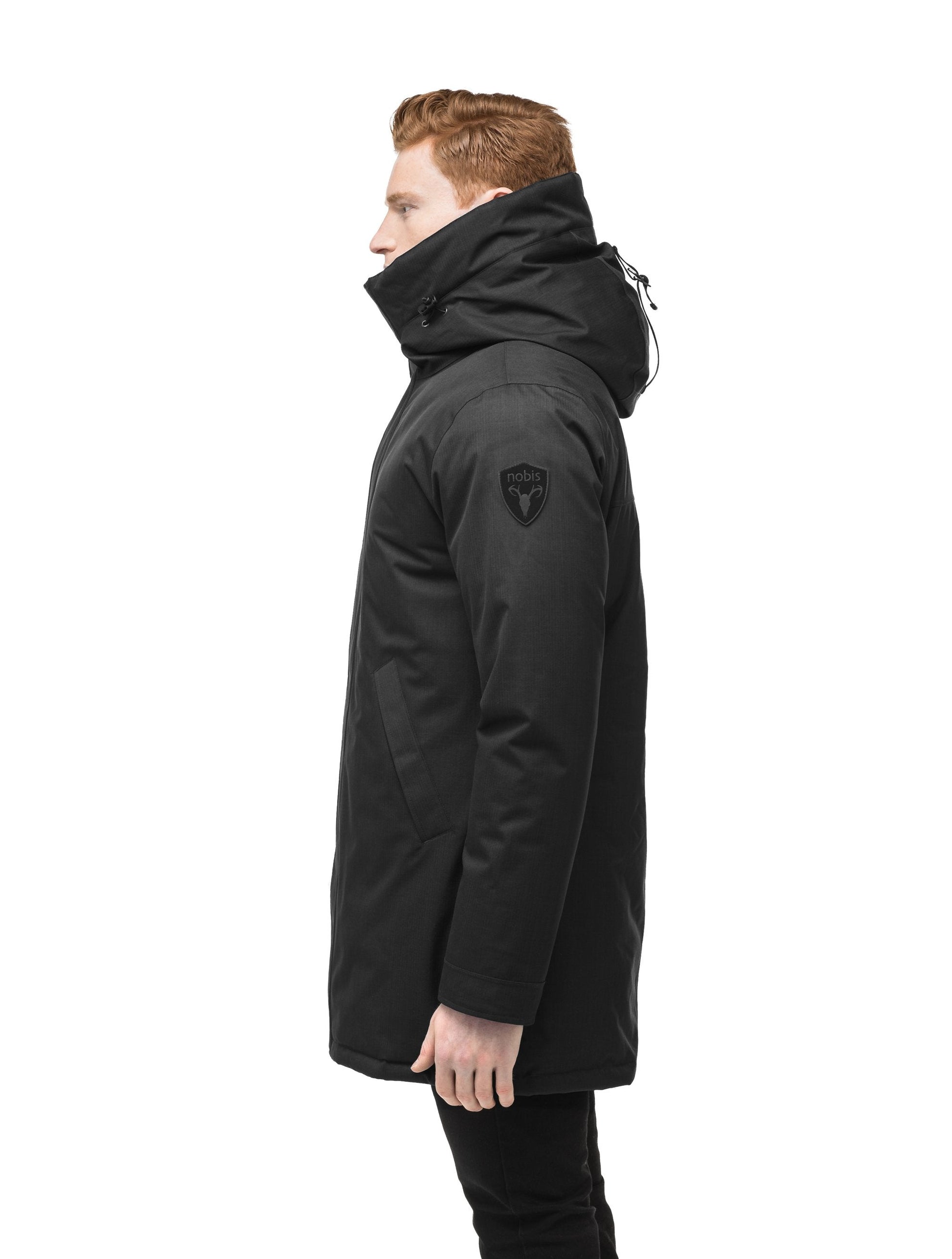 Pierre Men's Jacket in thigh length, Canadian white duck down insulation, non-removable down-filled hood, angled waist pockets, centre-front zipper with wind flap, and elastic ribbed cuffs, in Black