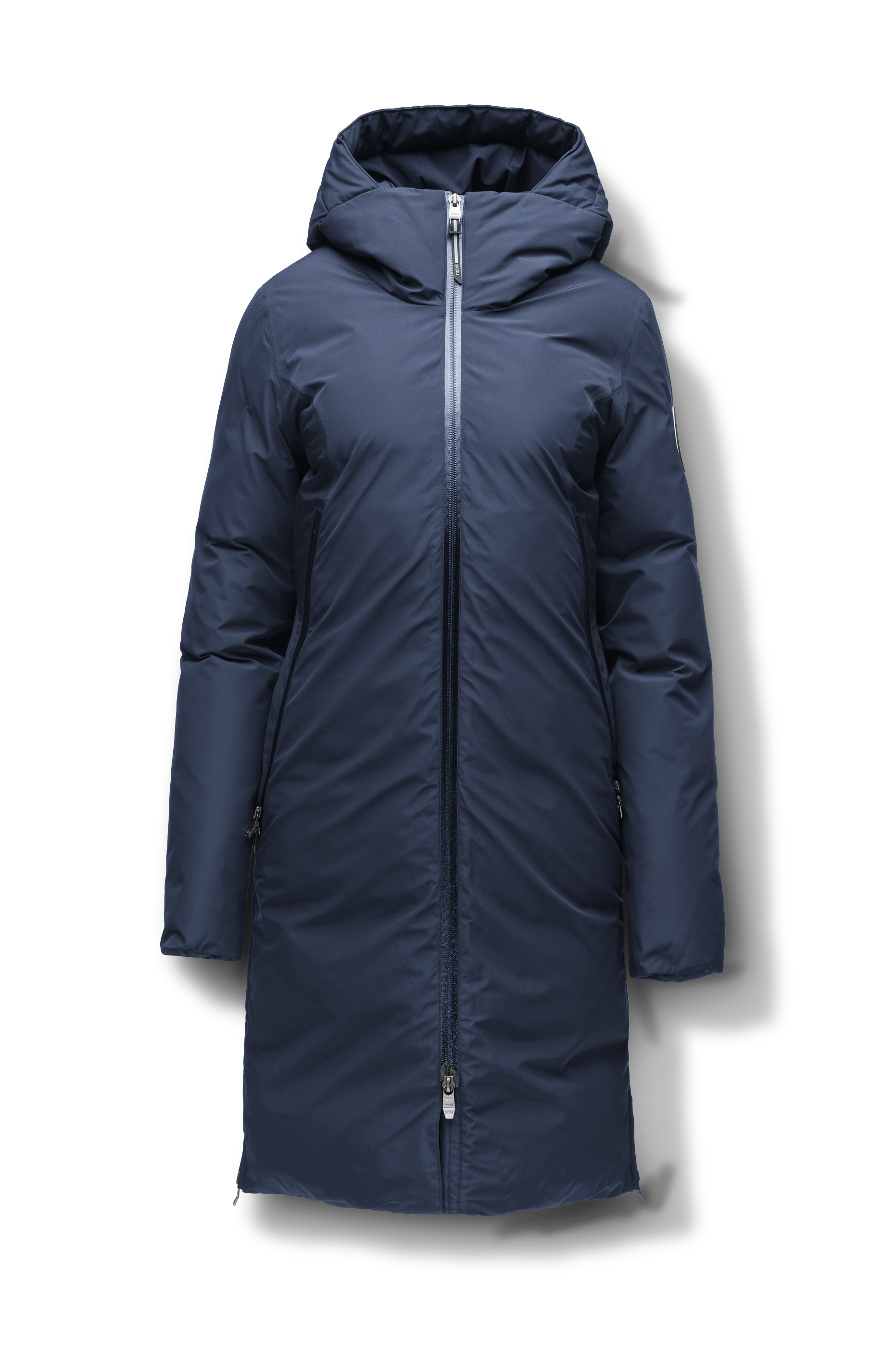Inara Women's Performance Parka in knee length, premium 3-ply micro denier and stretch ripstop fabrication with DWR coating, Premium Canadian White Duck Down insulation, non-removable down-filled hood, centre front two-way zipper, large vertical zipper pockets along waist, zipper vents along bottom side hem, in Marine