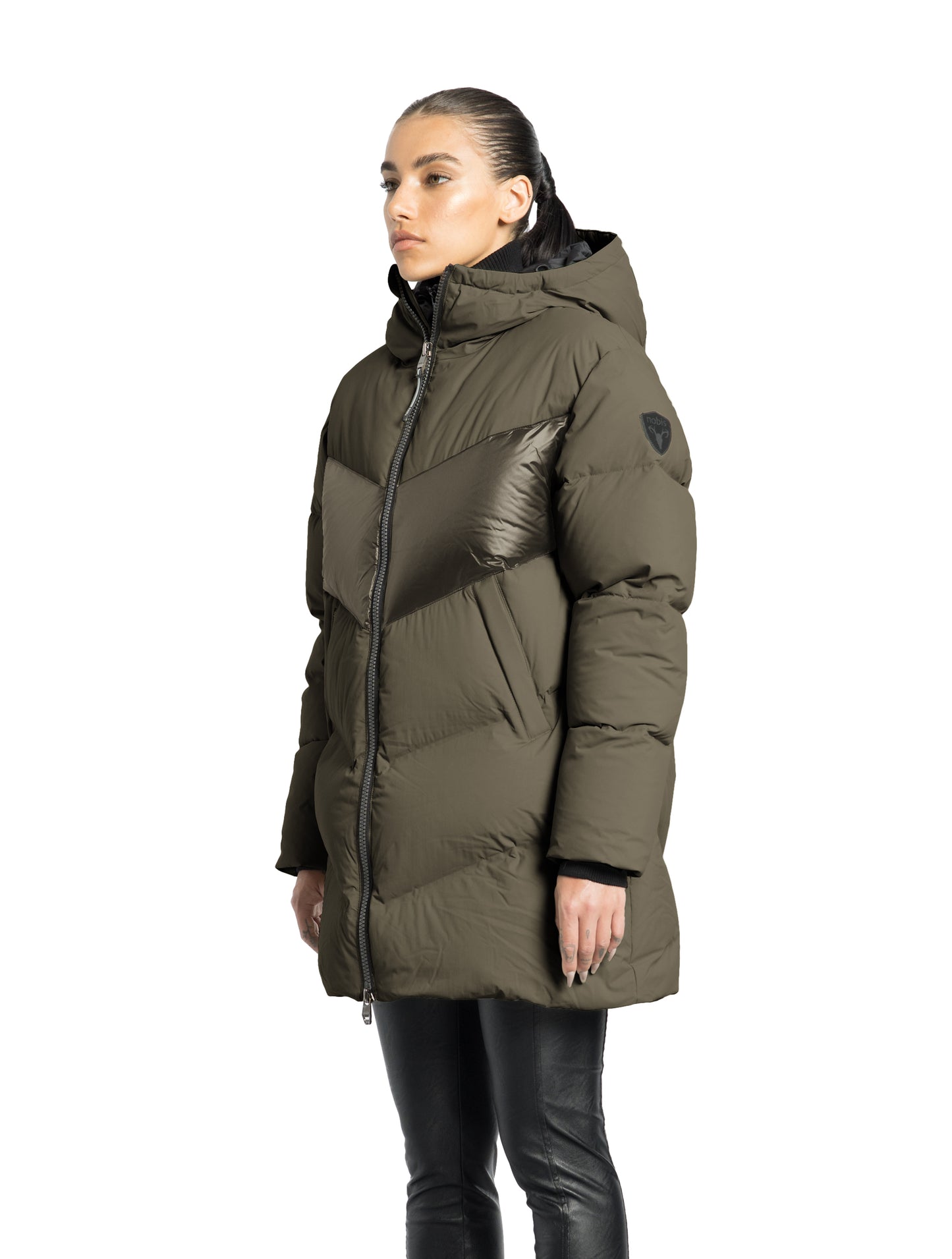 Isla Women's Chevron Quilted Puffer Jacket in thigh length, premium technical nylon taffeta fabrication, Premium Canadian origin White Duck Down insulation, non-removable down-filled hood, two-way centre-front zipper, zipper pockets at waist, contrast cire technical nylon taffeta detailing on chest and back, in Fatigue