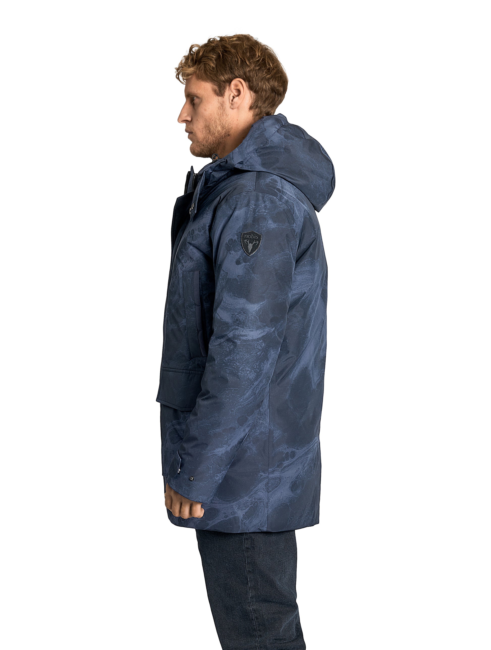 Kason Men's Light Down Parka in thigh length, premium 3-ply micro denier and stretch ripstop fabrication, Premium Canadian origin White Duck Down insulation, non-removable down-filled hood, two-way centre-front zipper, magnetic closure wind flap, fleece-lined pockets at chest and waist, flap pockets at waist, pit zipper vents, in Navy