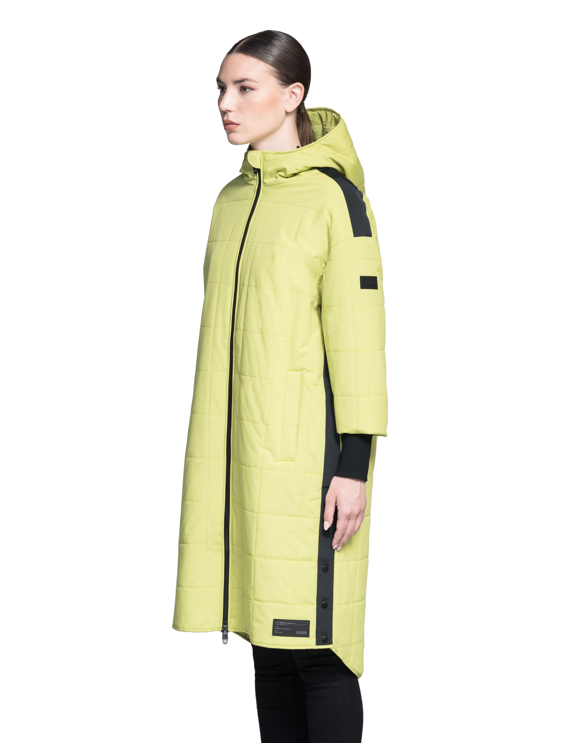 Radar Women's Performance Long Midlayer Jacket in long length, premium stretch ripstop and stretch Toray nylon fabrication, premium 4-way stretch, water resistant Primaloft Gold Insulation Active+, non-removable hood with adjustable draw cord, 2-way branded zipper at centre front, single welt pockets with magnetic closure at hips, elongated ribbed cuffs, grosgrain ribbon detail at shoulder and side seams, and snap closure side seam vent, in Dark Citron