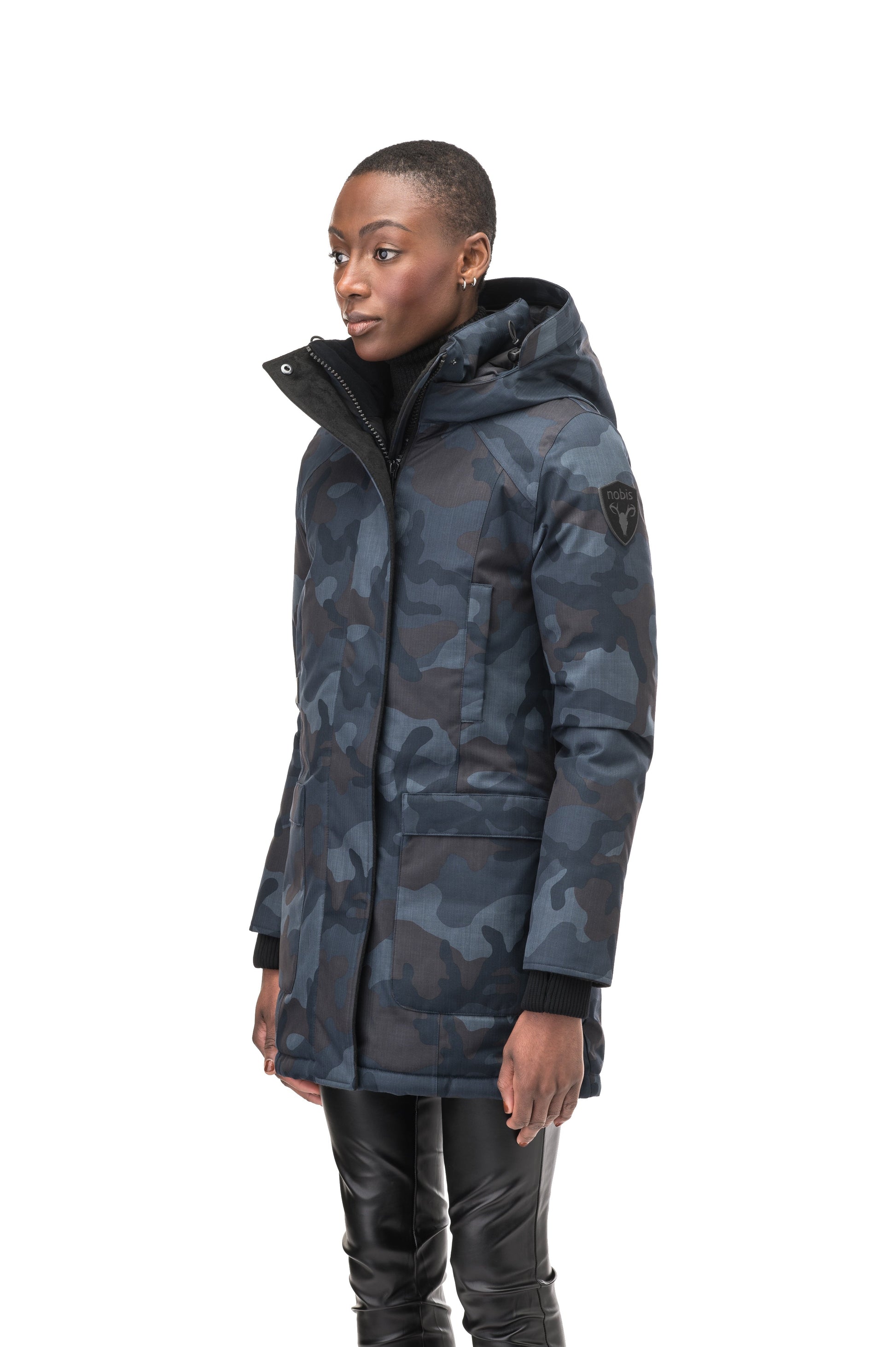 Women's down filled parka that sits just below the hip with a clean look and two hip patch pockets in Navy Camo