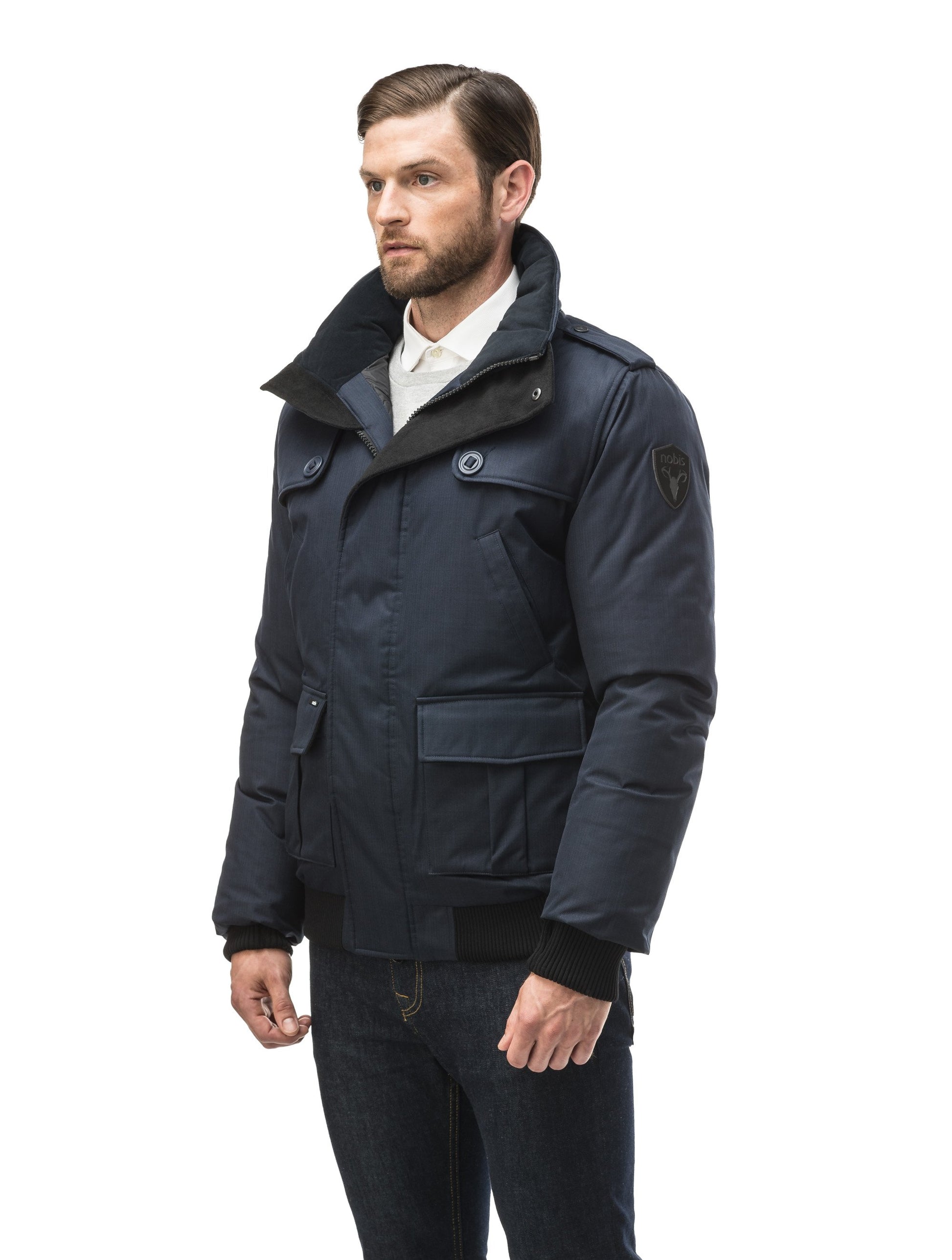 Men's down filled bomber that sits just above the hips with a completely removable hood that's windproof, waterproof, and breathable in CH Light Grey