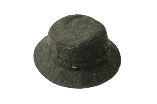 Reversible bucket hat in Fatigue color with one quilted side and one wool tweed side