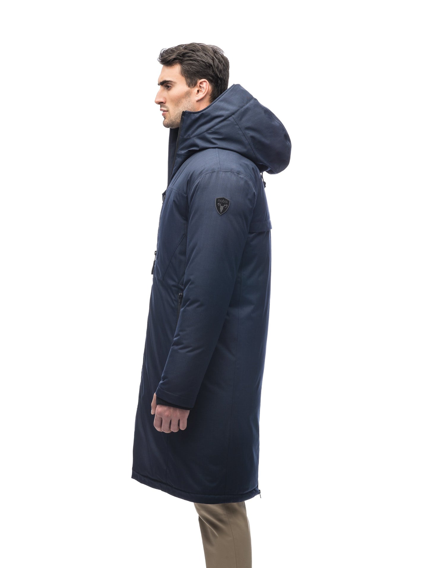 Long men's calf length parka with down fill and exposed zipper that features spacious pockets and zippered vents in Navy