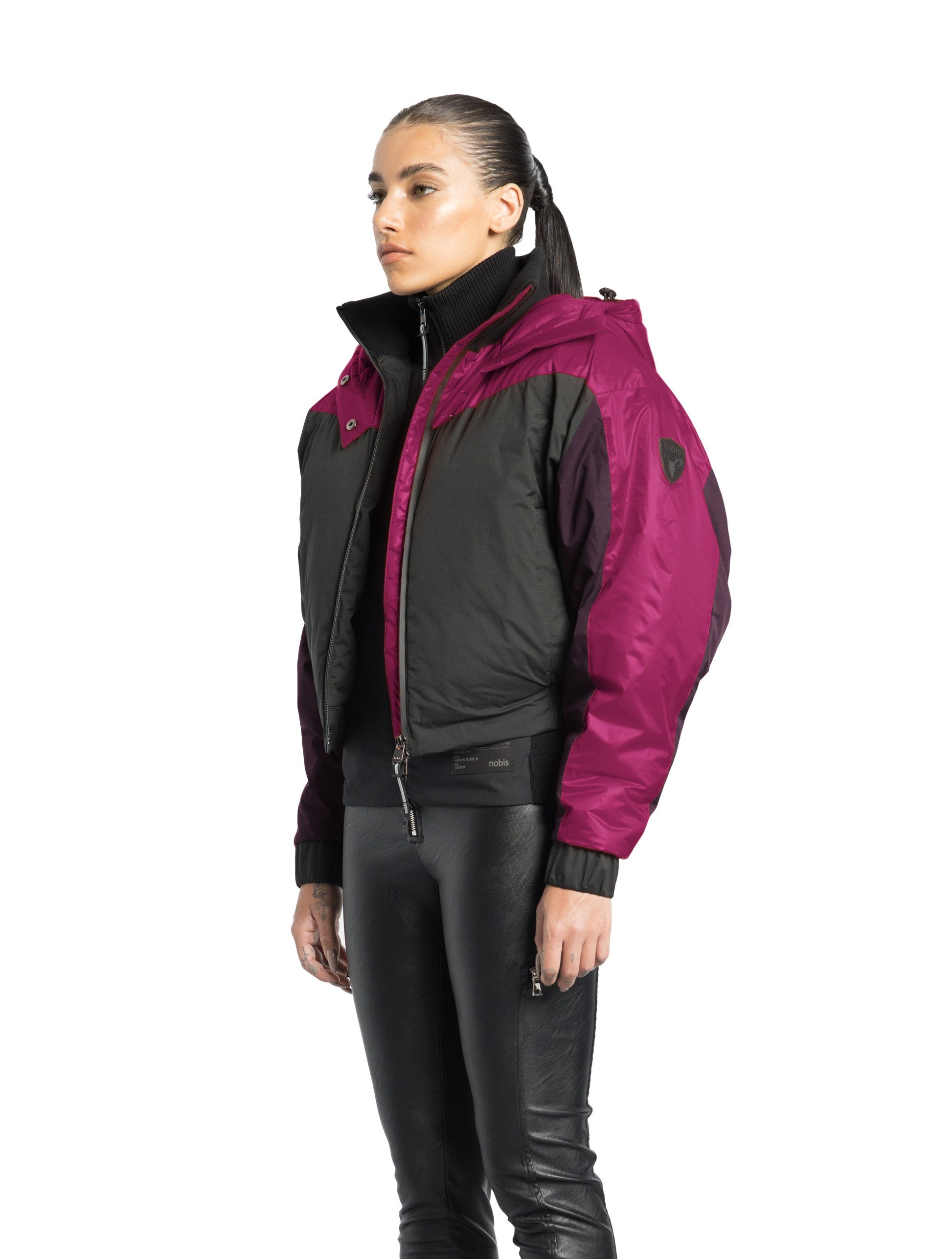 Aspen Women's Batwing Jacket in hip length, premium stretch ripstop and cire technical nylon taffeta fabrication, Premium Canadian White Duck Down insulation, non-removable down-filled hood, centre front two-way zipper, winged arm detailing, in Festival Fushia/Potent Purple