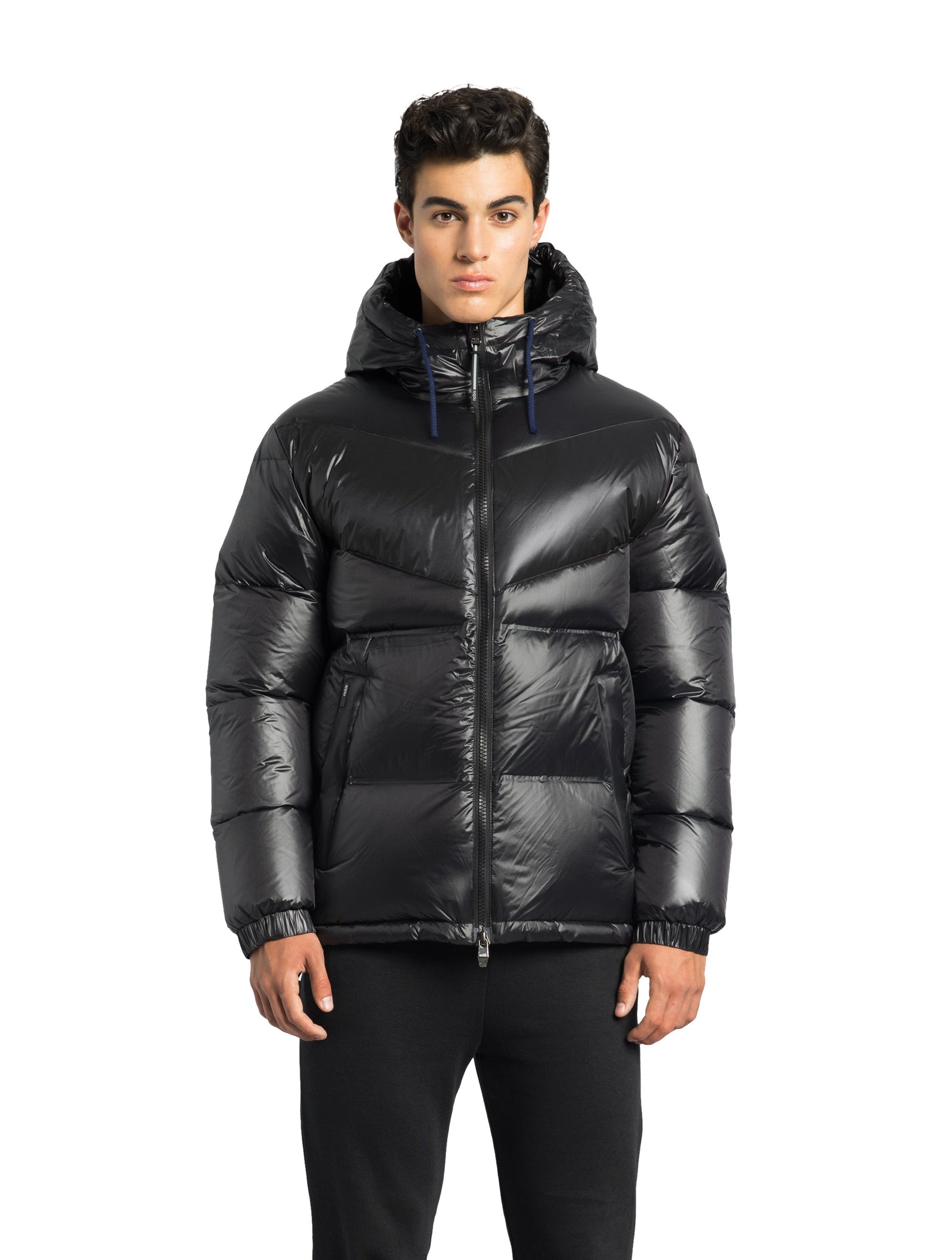 Dyna Men's Chevron Quilted Puffer Jacket in hip length, premium cire technical nylon taffeta fabrication, Premium Canadian origin White Duck Down insulation, non-removable down-filled hood, two-way centre-front zipper, fleece-lined zipper pockets at waist, pit zipper vents, in Black