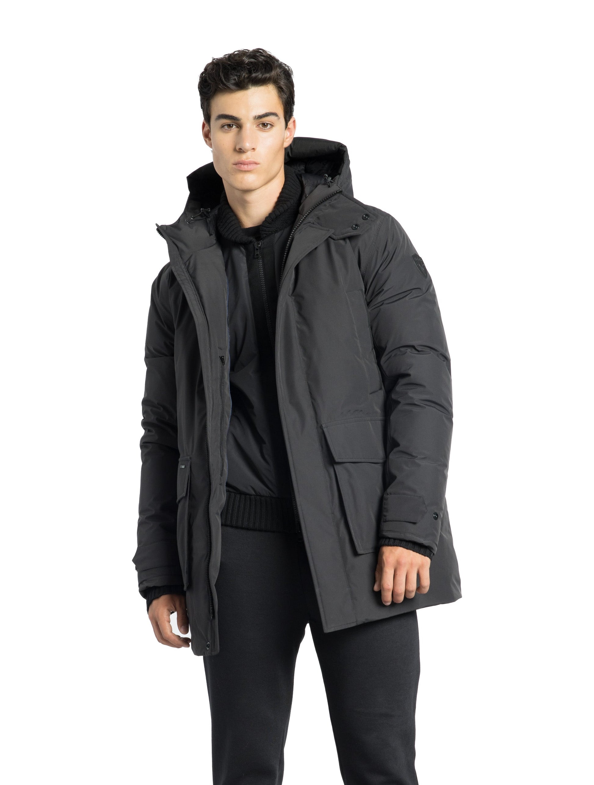 Kason Men's Light Down Parka in thigh length, premium 3-ply micro denier and stretch ripstop fabrication, Premium Canadian origin White Duck Down insulation, non-removable down-filled hood, two-way centre-front zipper, magnetic closure wind flap, fleece-lined pockets at chest and waist, flap pockets at waist, pit zipper vents, in Black