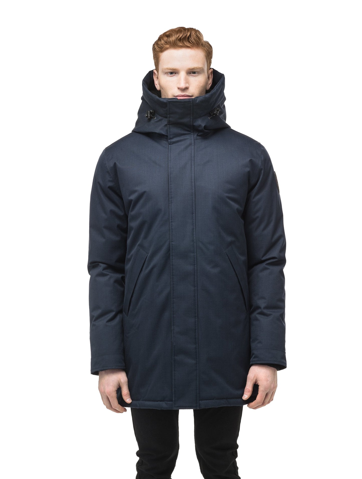 Pierre Men's Jacket in thigh length, Canadian white duck down insulation, non-removable down-filled hood, angled waist pockets, centre-front zipper with wind flap, and elastic ribbed cuffs, in Navy