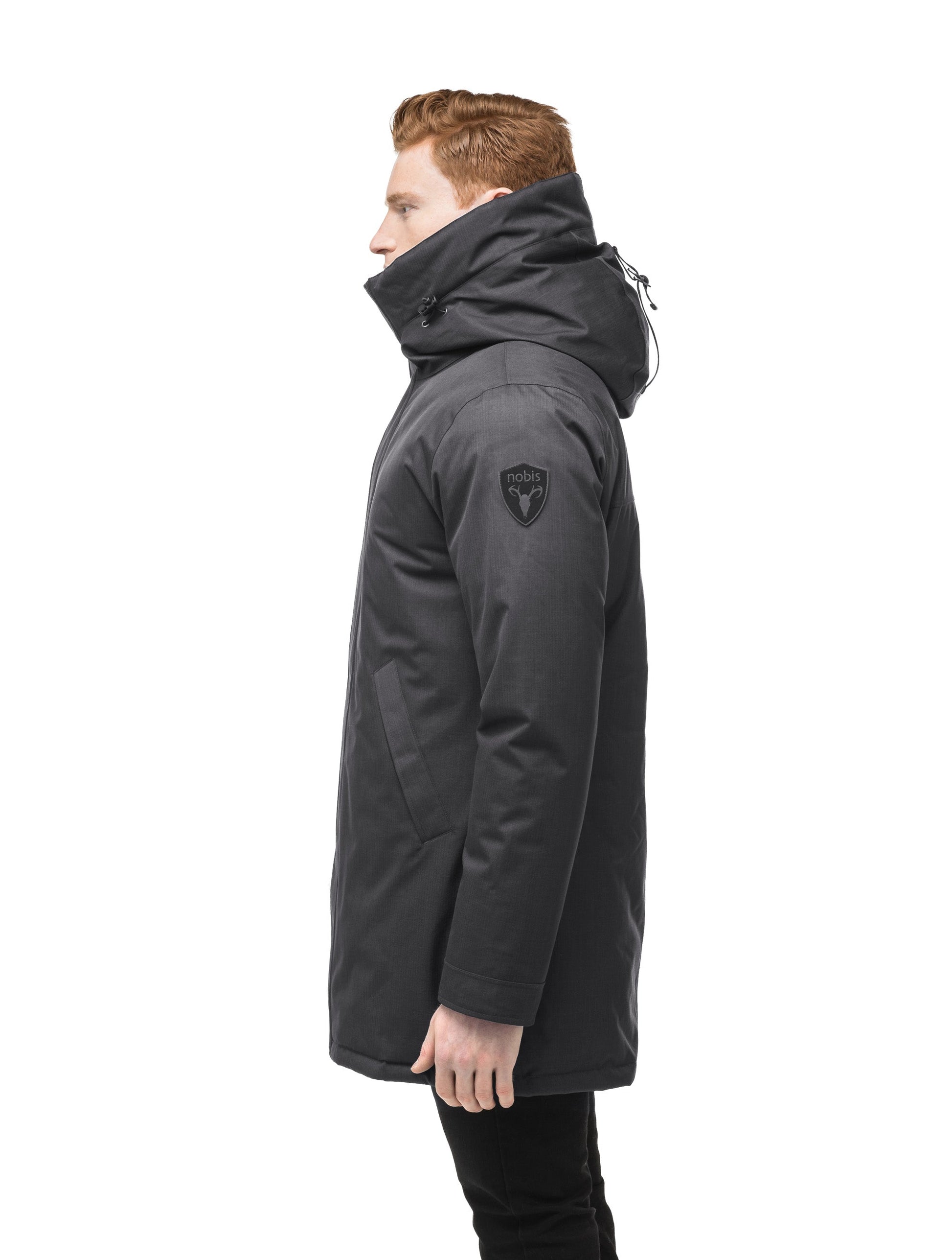 Pierre Men's Jacket in thigh length, Canadian white duck down insulation, non-removable down-filled hood, angled waist pockets, centre-front zipper with wind flap, and elastic ribbed cuffs, in Steel Grey