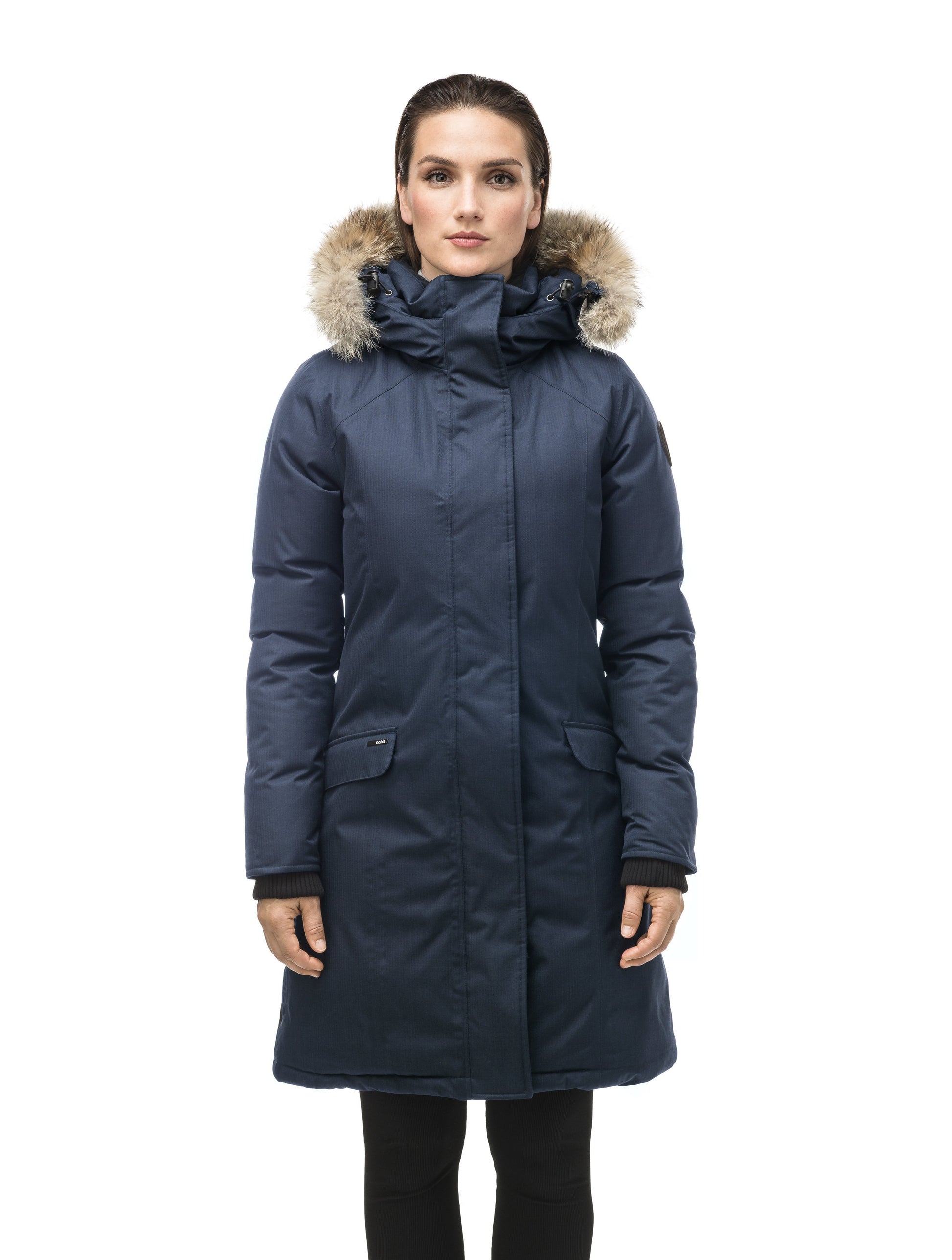 Rebecca Women's Parka in knee length, Canadian duck down insulation, two-way zipper with magnetic front placket, non-removable hood with removable coyote fur trim, in Navy