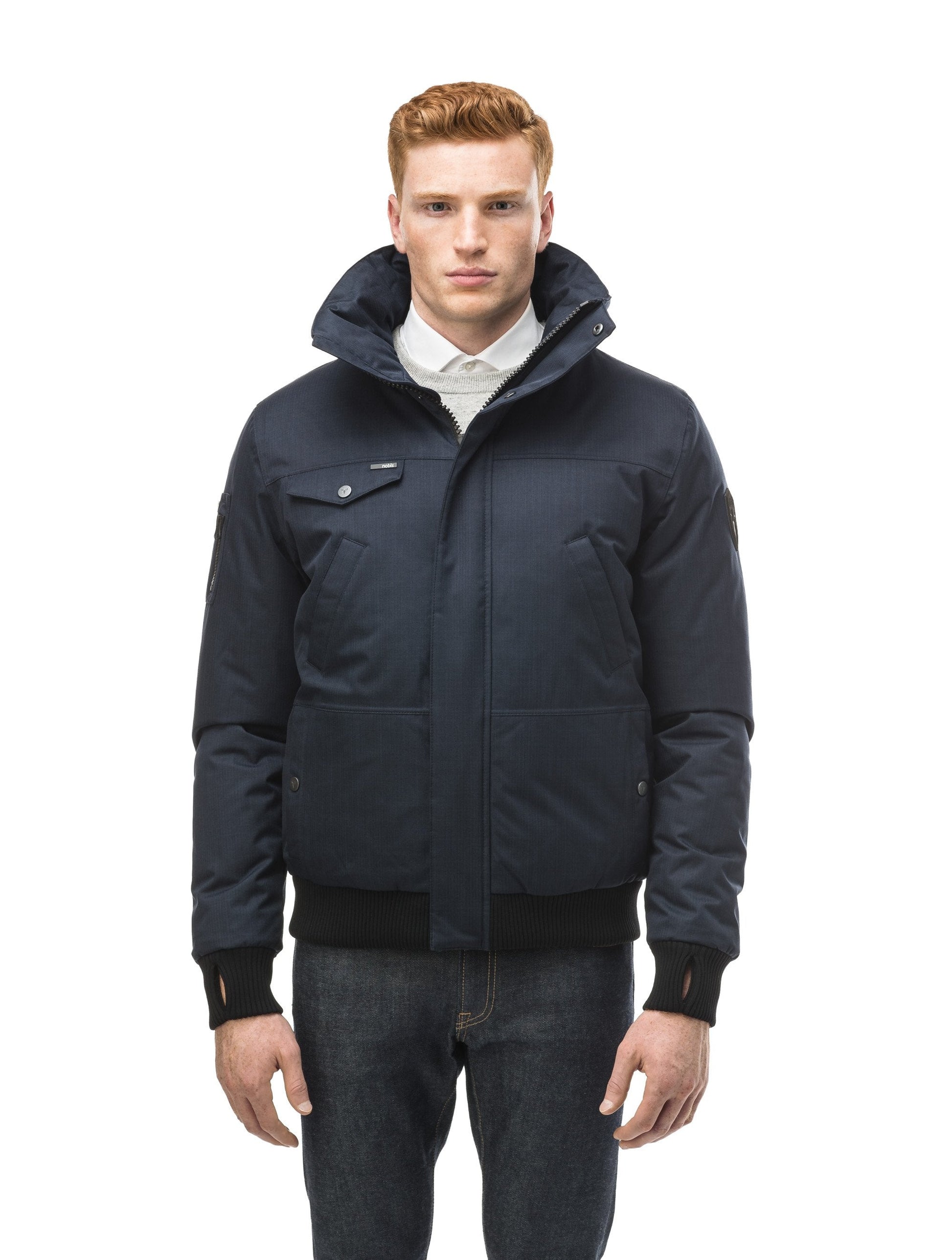 Men's sleek down filled bomber jacket with clean details and a fur free hood in CH Navy
