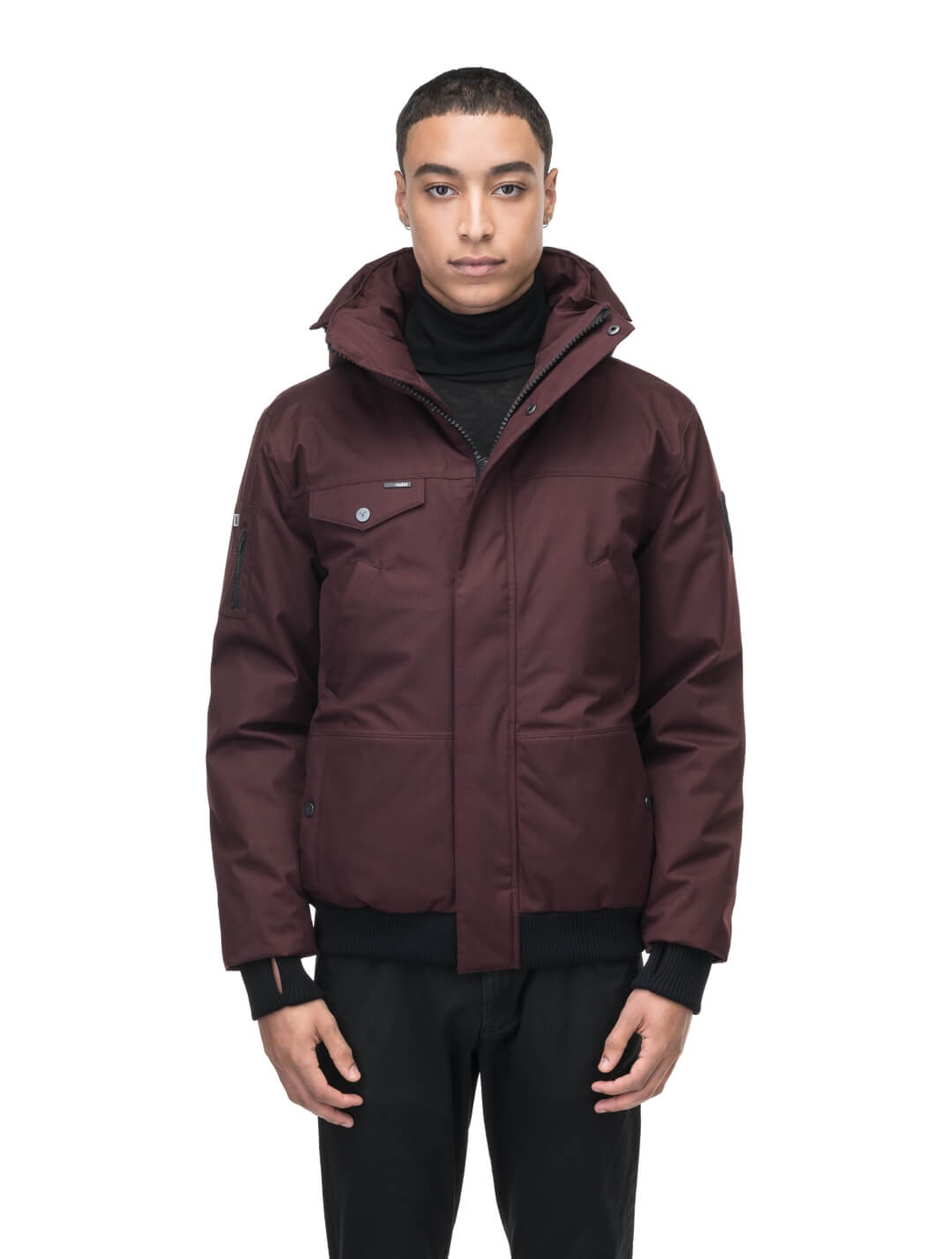 Men's sleek down filled bomber jacket with clean details and a fur free hood in Merlot