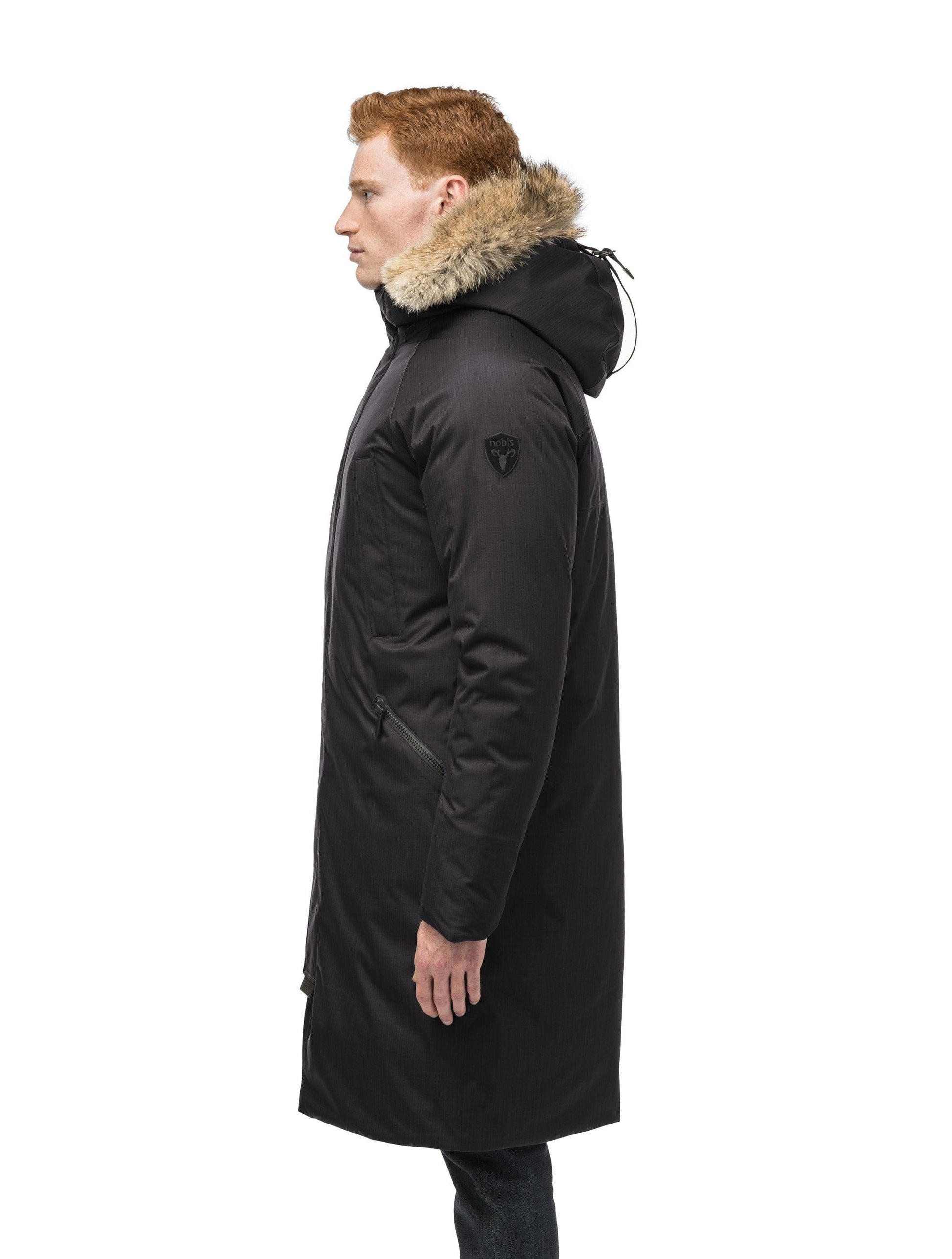 This ankle length men's down filled parka doubles as an over coat with a removable fur trim on the hood in Black