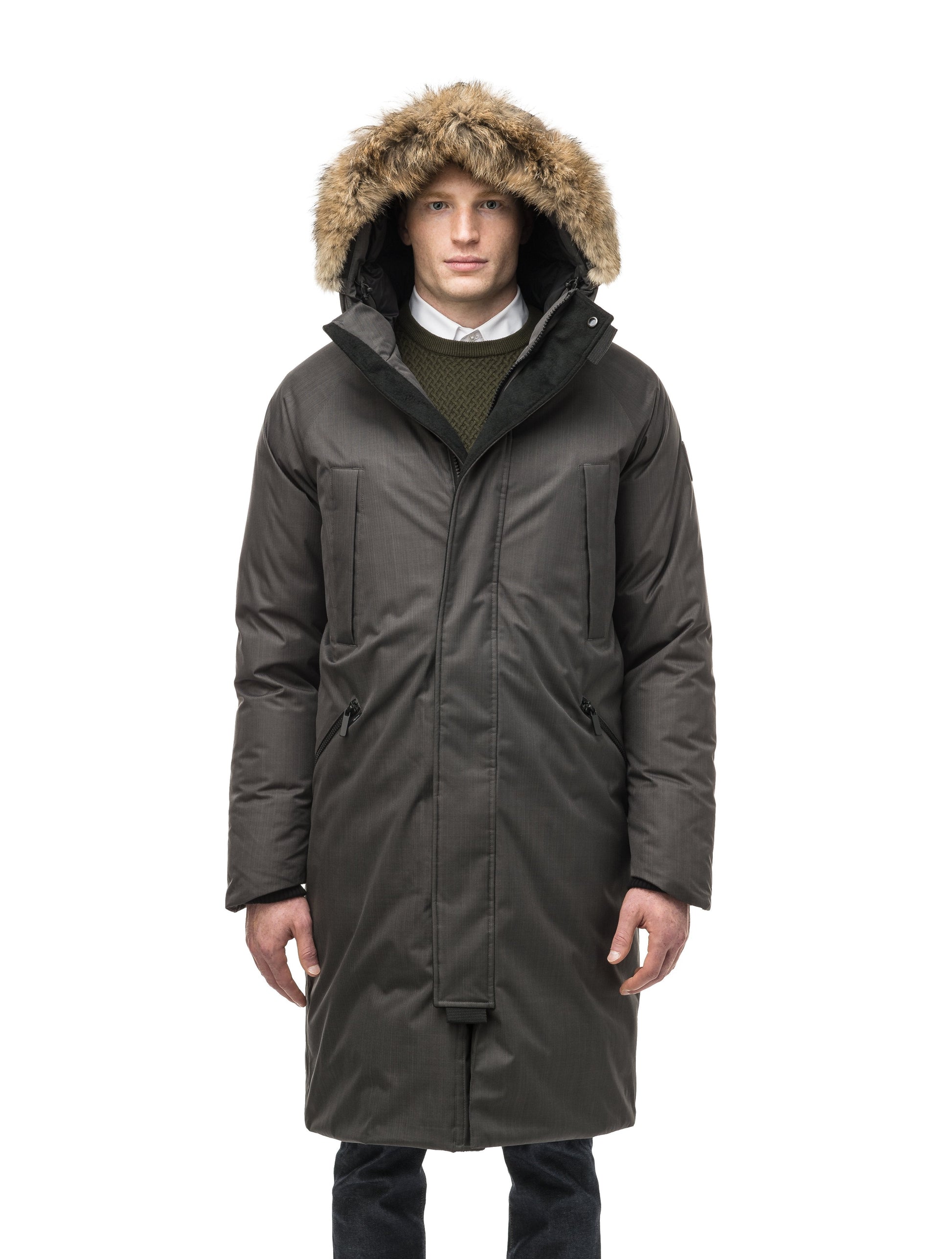 This ankle length men's down filled parka doubles as an over coat with a removable fur trim on the hood in Steel Grey