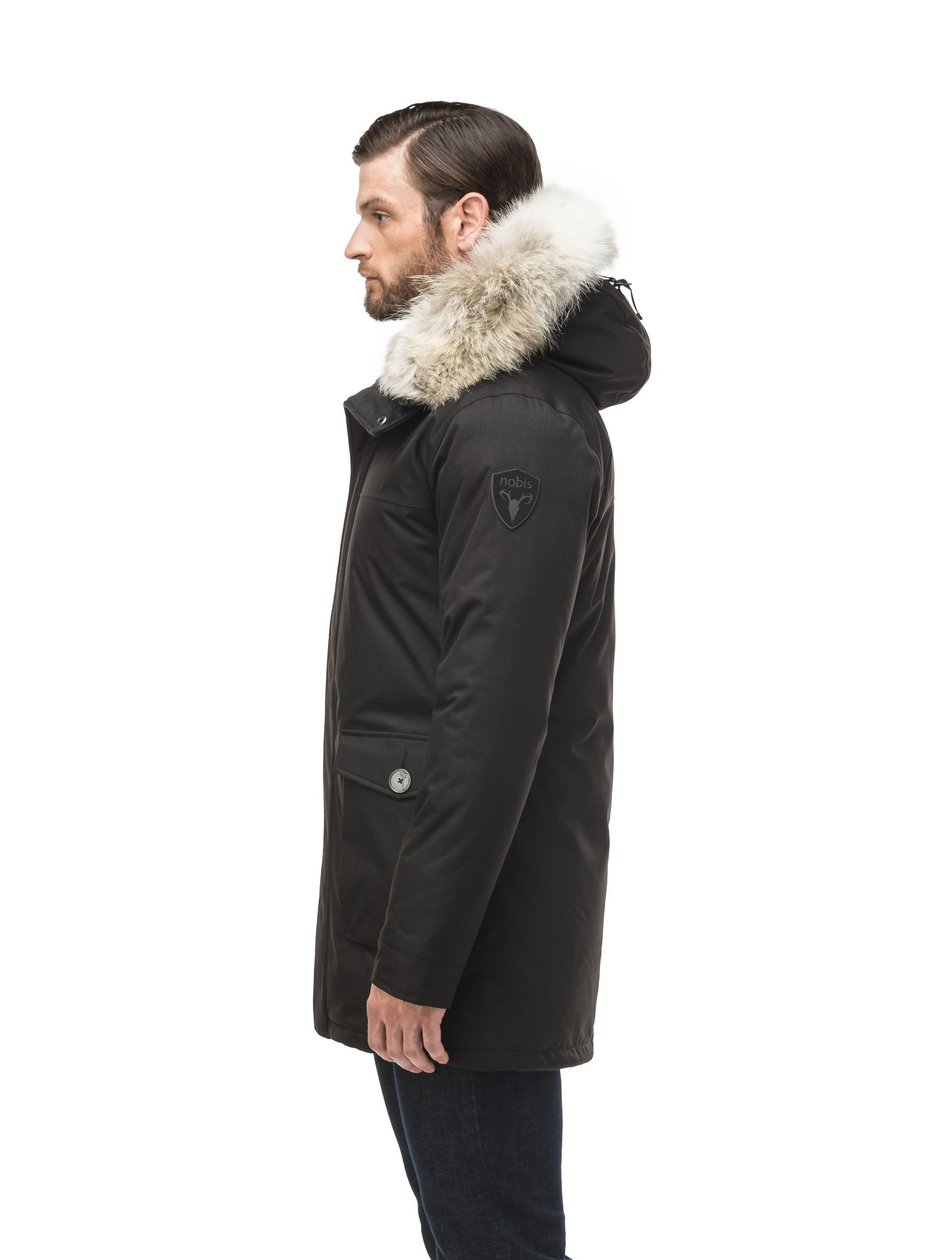 Men's slim fitting waist length parka with removable fur trim on the hood and two waist patch pockets in CH Black